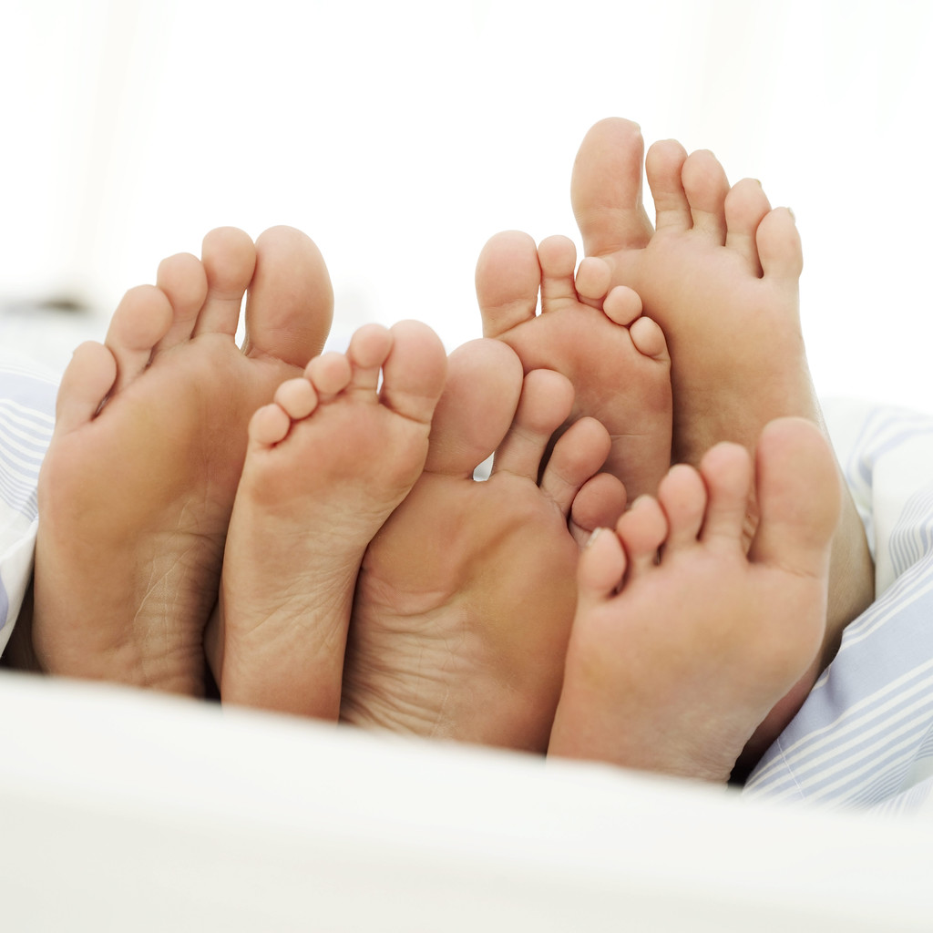 Soles of a Couple and Their Child